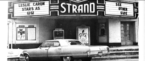 Strand Theatre on Main Street. The double doors to the right of the ticket window was the "Colored" entrance. Black moviegoers would enter the doors and buy their tickets through an interior ticket window served by a single ticket seller, usually Mrs. Watson, and then ascend the stairs to the segregated balcony to see the show. Whites sat on the main floor.