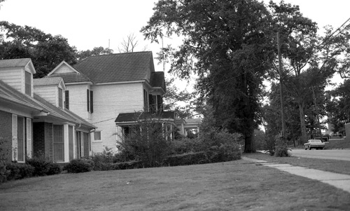 Looking west on Middle Street standing in front of the Methodist Church, 1972. The closest house on the left is the Methodist parsonage. The two story house is the old Peterson place. Charlotte Peterson, elementary school principal, lived in the house for many years.