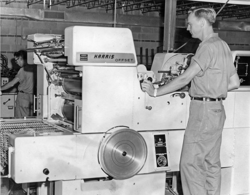 Bobby Roman operates the Harris 20 x 26 inch single color offset press. The press was purchased new when Times Printing moved into the new plant in the basement of the Whaley Shopping Center and became the workhorse of the business.