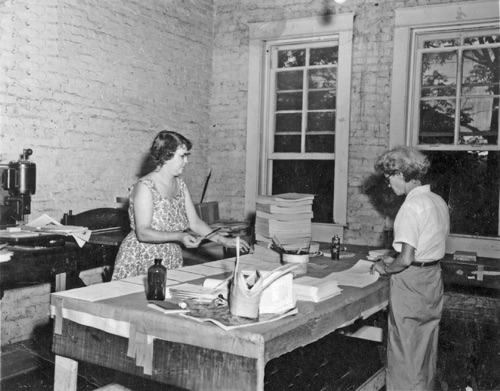 Vedie Wyatt with her friend and loyal employee, Mrs. Montgomery, doing bindery work in the back room of the first floor. The windows are the same ones you can see in the photos of the rear of the building.
