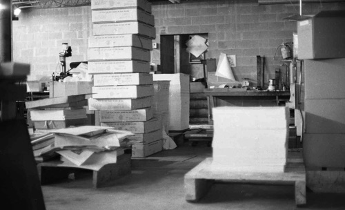 Many cartons of paper stacked for a typical large printing job in the offset press area at Times Printing. A job this size would take several days to run.